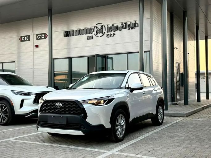 New Toyota Corolla Cross I, 2.0 l, 2024 in Ajman by MWH MOTORS FZE, White color. Chinese Specs | AUTO.AE