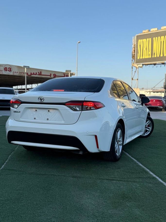 Подержанный Toyota Corolla Axio XI (E160, E170) Рестайлинг 2, 1.5 л, 2021 в Аджмане от Syria Motors Белый цвет. Японская | AUTO.AE