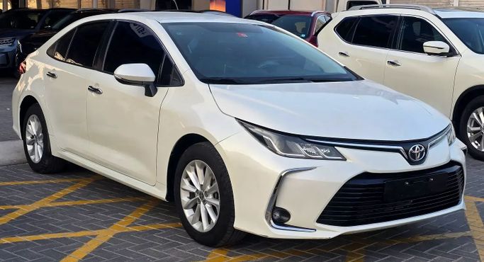 Подержанный Toyota Corolla XII (E210), 1.6 л, 2020 в Аджмане от Al Hilal Motors Белый цвет. GCC | AUTO.AE