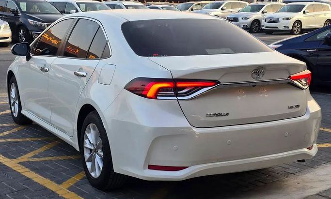 Подержанный Toyota Corolla XII (E210), 1.6 л, 2020 в Аджмане от Al Hilal Motors Белый цвет. GCC | AUTO.AE