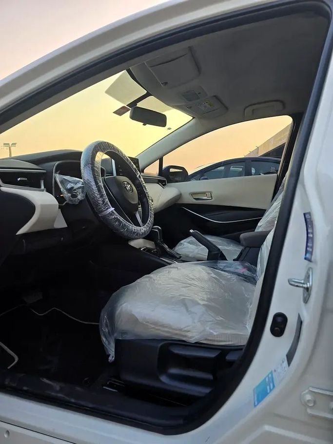 Подержанный Toyota Corolla XII (E210), 1.6 л, 2020 в Аджмане от Al Hilal Motors Белый цвет. GCC | AUTO.AE