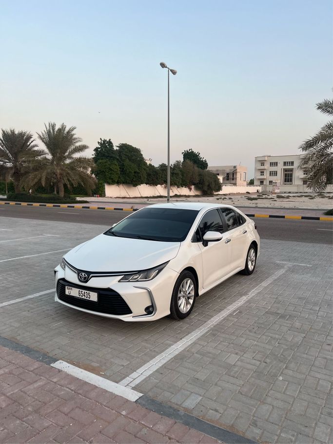 Подержанный Toyota Corolla XII (E210), 1.6 л, 2021 в Аджмане Белый цвет. GCC | AUTO.AE
