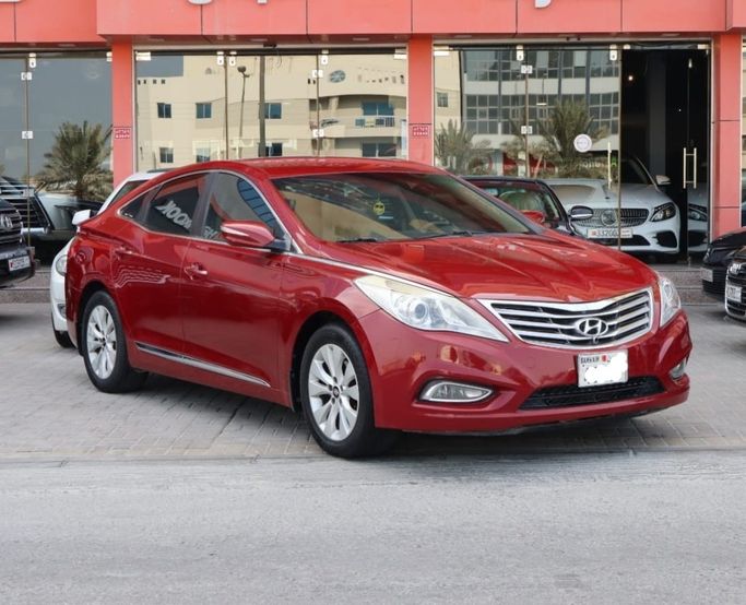 Подержанный ⁦Hyundai Azera II, 3.0 л, 2012⁩ в Бахрейн, Ар Рифа‘ от alhoot class showroom Красный цвет.  | AUTO.AE | Объявление #291336