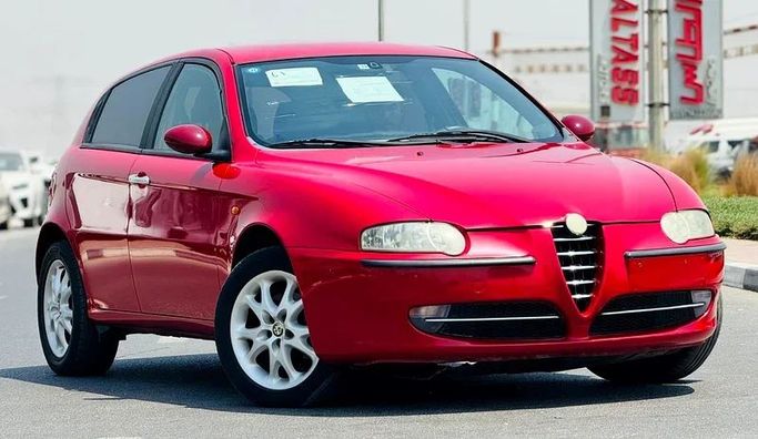 Подержанный Alfa Romeo 147 I, 2.0 л, 2003 в Дубае от Mirza Automobile FZE Красный цвет. Японская | AUTO.AE