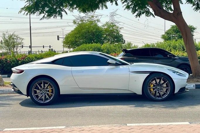 Used Aston Martin DB11 I, 5.2 l, 2017 in Dubai by 66 Motors, White color. GCC Specs | AUTO.AE