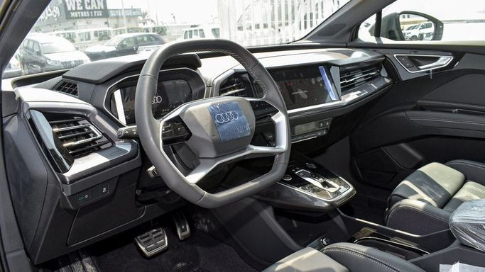 New Audi Q4 e-tron 40, 2024 in Dubai by Najem Motors, Grey color. Chinese Specs | AUTO.AE