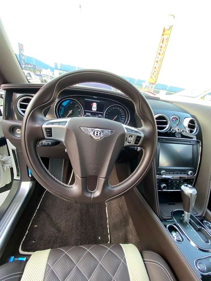 Used Bentley Flying Spur II, 6.0 l, 2018 in Dubai by Formula Motors, White color. Japanese Specs | AUTO.AE