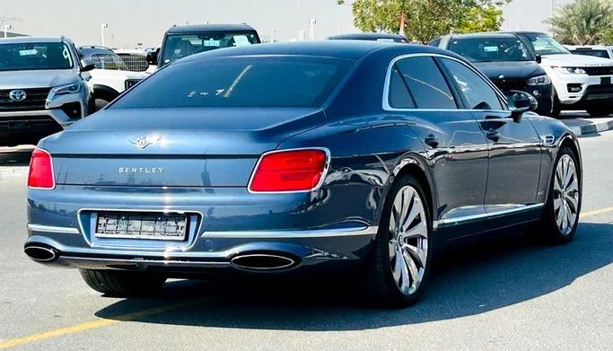 Подержанный Bentley Flying Spur III, 6.0 л, 2020 в Дубае от Mirza Automobile FZE Голубой цвет. Японская | AUTO.AE