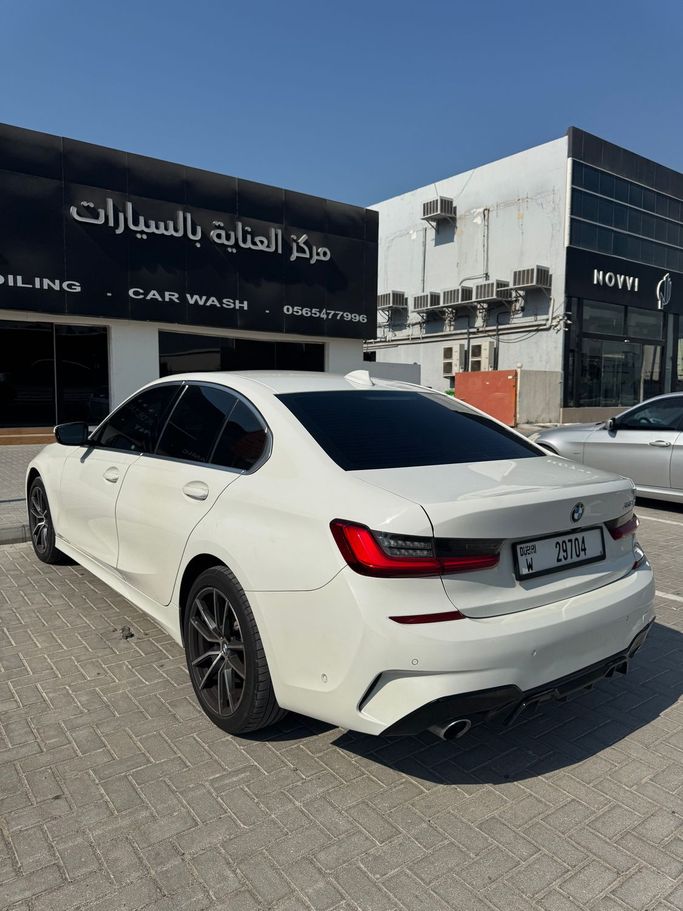 Подержанный BMW 3 Series 330i VII (G2x), 2.0 л, 2020 в Дубае Белый цвет. Американская | AUTO.AE