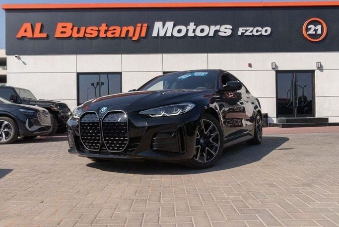 Новый BMW i4 eDrive40 G26 Рестайлинг, 2025 в Дубае от Albustanji Motors FZCO Черный цвет.  | AUTO.AE