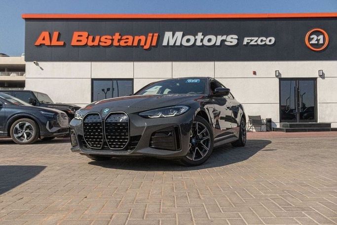 Новый BMW i4 eDrive40 G26 Рестайлинг, 2025 в Дубае от Albustanji Motors FZCO Серый цвет.  | AUTO.AE