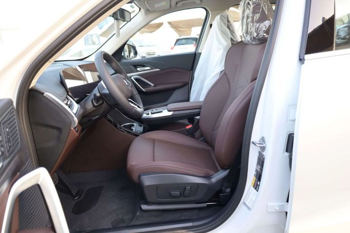 New BMW iX1 eDrive, 2025 in Dubai by JES Motors, White color.  | AUTO.AE