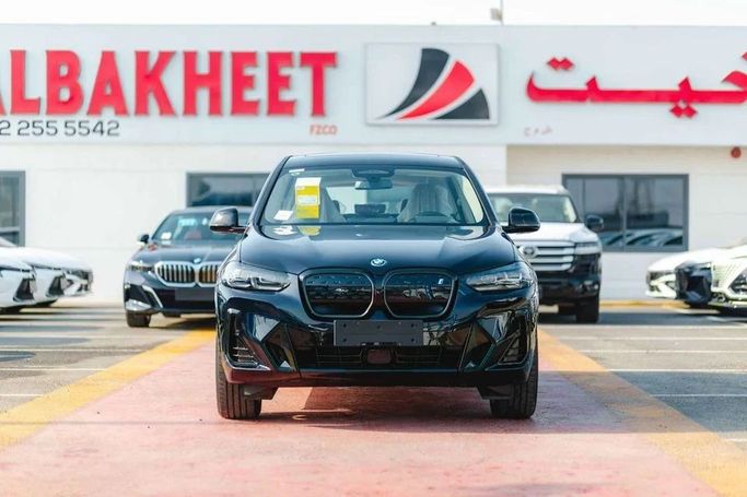 New BMW iX3 I (G08) Facelift, 2025 in Dubai by Albakheet Motors, Black color. Chinese Specs | AUTO.AE