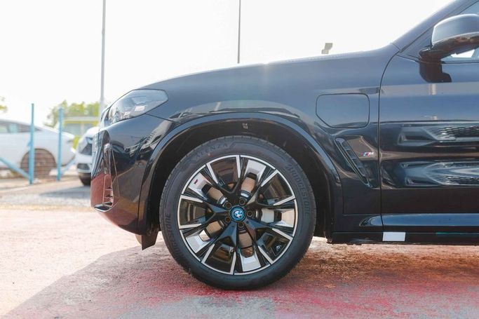 New BMW iX3 I (G08) Facelift, 2025 in Dubai by Albakheet Motors, Black color. Chinese Specs | AUTO.AE