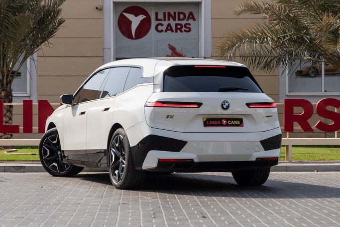 Used BMW iX xDrive50 I (I20), 2023 in Dubai by Linda Cars, White color. GCC Specs | AUTO.AE