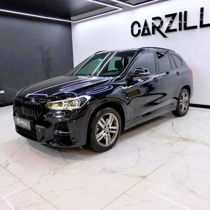 Used BMW X1 20i sDrive II (F48) Facelift, 2.0 l, 2022 in Dubai by Carzilla Motors, Black color. GCC Specs | AUTO.AE