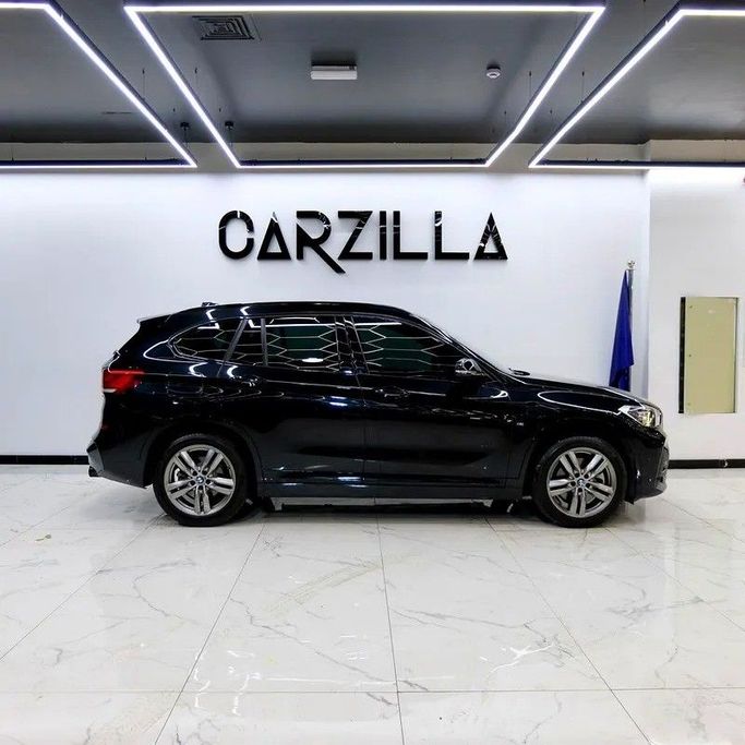 Used BMW X1 20i sDrive II (F48) Facelift, 2.0 l, 2022 in Dubai by Carzilla Motors, Black color. GCC Specs | AUTO.AE