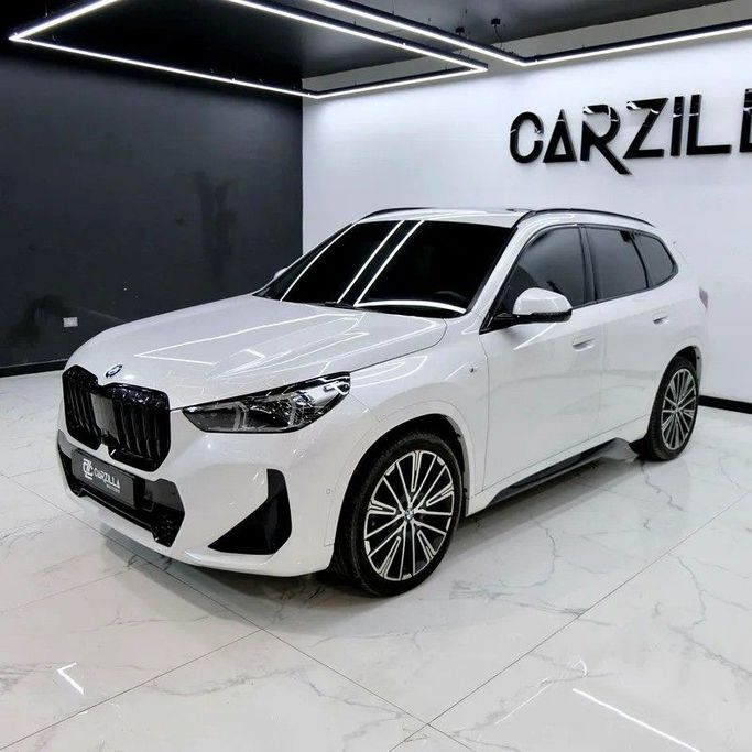 Used BMW X1 20i sDrive III (U11/U12), 1.5 l, 2023 in Dubai by Carzilla Motors, White color. GCC Specs | AUTO.AE