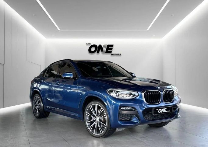 Used BMW X4 30i II (G02), 2.0 l, 2021 in Dubai by The One Motors, Blue color. GCC Specs | AUTO.AE