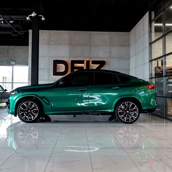 BMW X6 M III (F96) Facelift, 2024 sport suv 5 dr. for rent in Dubai by DEIZ, green color | AUTO.AE