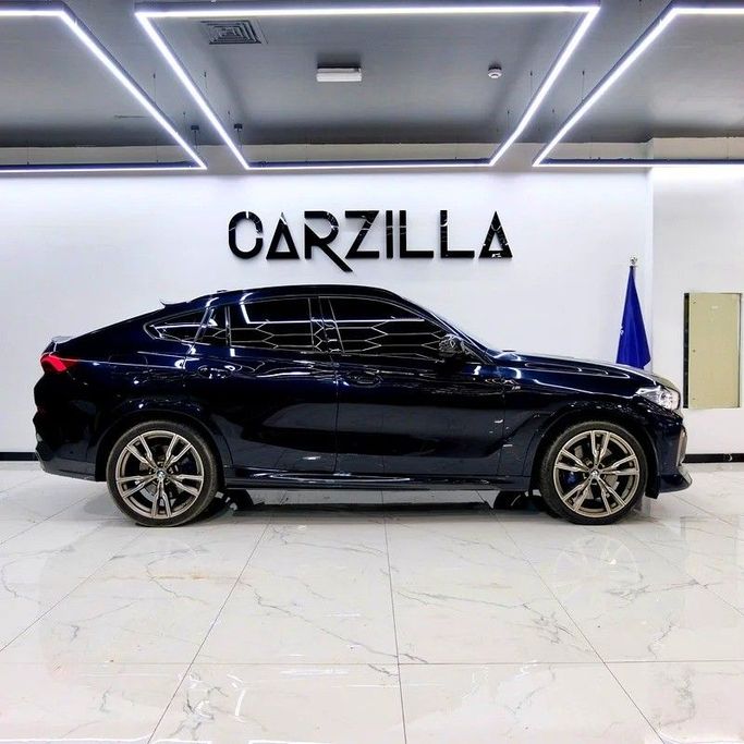 Used BMW X6 M50i III (G06), 4.4 l, 2021 in Dubai by Carzilla Motors, Blue color. GCC Specs | AUTO.AE