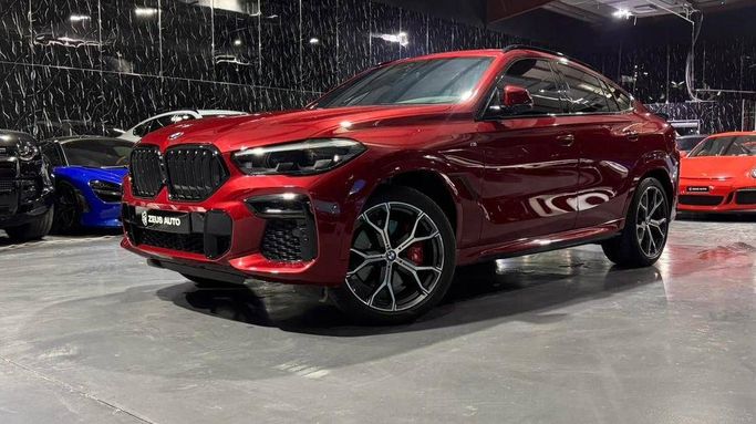 Used BMW X6 40i III (G06), 3.0 l, 2023 in Dubai by Zeus Motors, Red color. GCC Specs | AUTO.AE