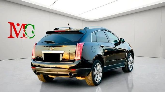 Подержанный Cadillac SRX II, 3.6 л, 2011 в Дубае от Mirza Automobile FZE Черный цвет. Японская | AUTO.AE