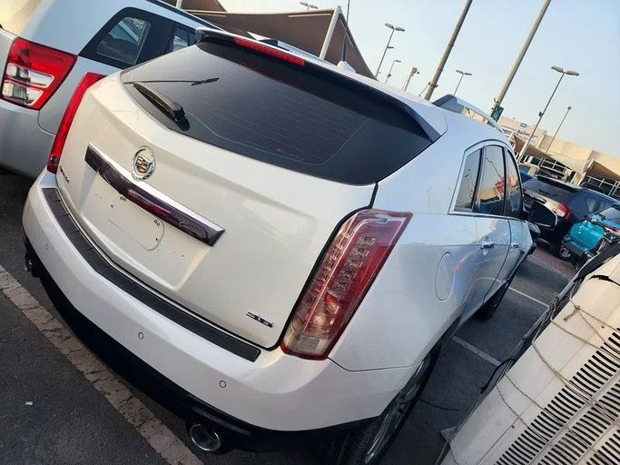 Подержанный Cadillac SRX II Рестайлинг, 3.6 л, 2014 в Дубае от Abdo Al Muthanna Used Cars Белый цвет. GCC | AUTO.AE