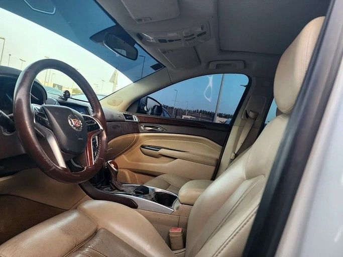 Подержанный Cadillac SRX II Рестайлинг, 3.6 л, 2014 в Дубае от Abdo Al Muthanna Used Cars Белый цвет. GCC | AUTO.AE