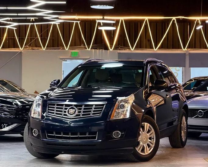 Подержанный Cadillac SRX II Рестайлинг, 3.6 л, 2014 в Дубае от Morya Jeswani Cars Тёмно-синий цвет. GCC | AUTO.AE