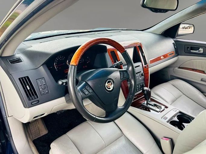 Подержанный Cadillac STS I, 3.6 л, 2006 в Дубае от Mirza Automobile FZE Черный цвет. Японская | AUTO.AE