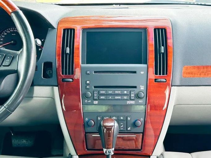 Подержанный Cadillac STS I, 3.6 л, 2006 в Дубае от Mirza Automobile FZE Черный цвет. Японская | AUTO.AE