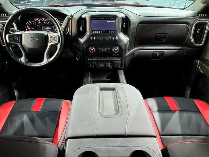 Подержанный Chevrolet Silverado IV (T1XX), 5.3 л, 2021 в Дубае от Hot Wheel Used Motors Красный цвет. Other | AUTO.AE