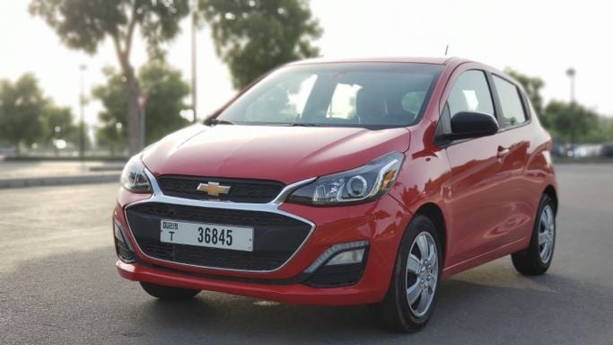 Chevrolet Spark IV Facelift, 2022  hatchback 5 dr. for rent in Dubai by more rent a car, red color | AUTO.AE