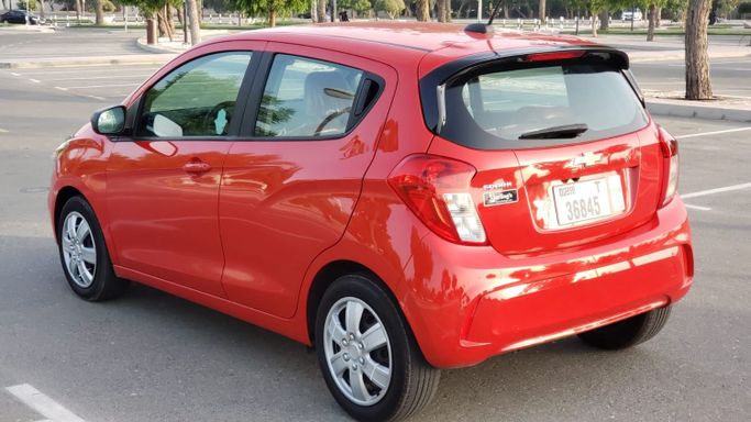 Chevrolet Spark IV Facelift, 2022  hatchback 5 dr. for rent in Dubai by more rent a car, red color | AUTO.AE