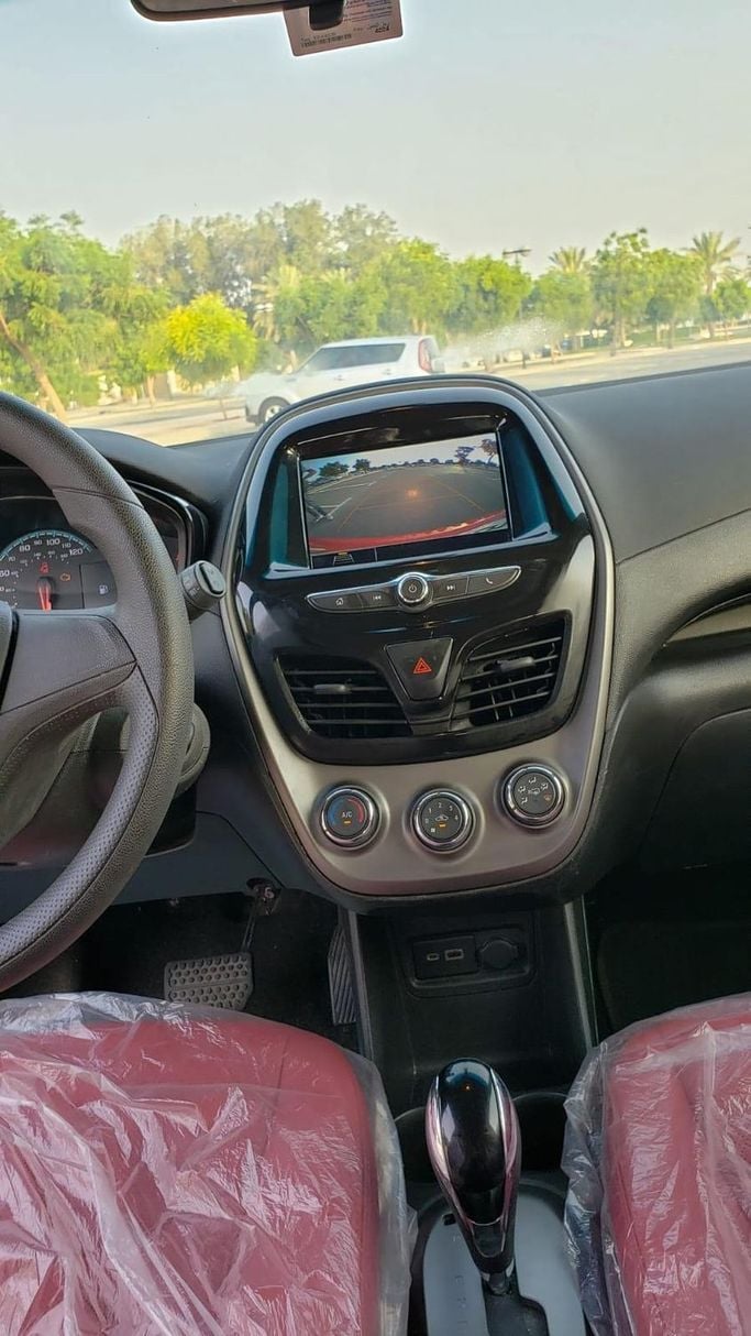 Chevrolet Spark IV Facelift, 2022  hatchback 5 dr. for rent in Dubai by more rent a car, red color | AUTO.AE