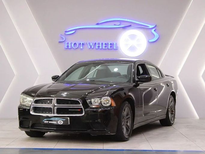 Подержанный Dodge Charger VII (LD), 3.6 л, 2013 в Дубае от Hot Wheel Used Motors Черный цвет. GCC | AUTO.AE