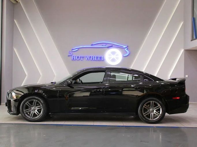 Подержанный Dodge Charger VII (LD), 3.6 л, 2013 в Дубае от Hot Wheel Used Motors Черный цвет. GCC | AUTO.AE