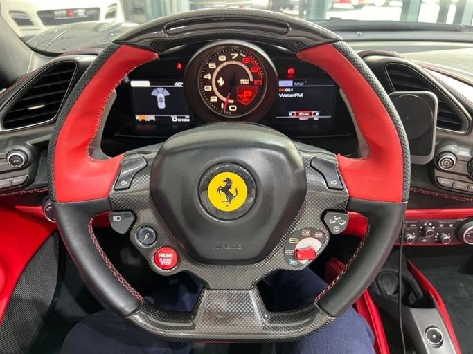 Used Ferrari 488 Spider, 3.9 l, 2018 in Dubai by Quatro Motors, Black color. GCC Specs | AUTO.AE