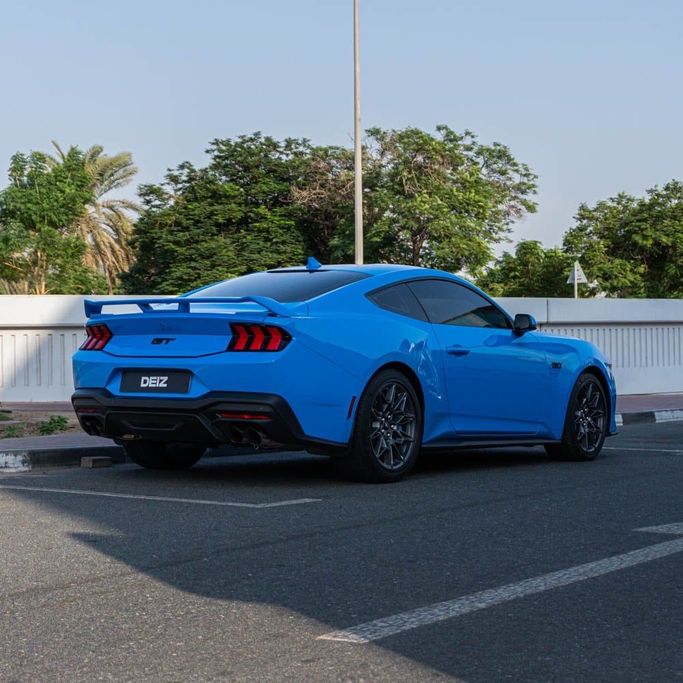 Ford Mustang VI Facelift, 2024 standard coupe for rent in Dubai by DEIZ, light blue color | AUTO.AE
