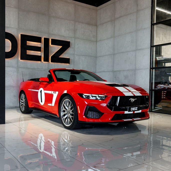 Ford Mustang VI Facelift, 2024 standard cabriolet for rent in Dubai by DEIZ, red color | AUTO.AE