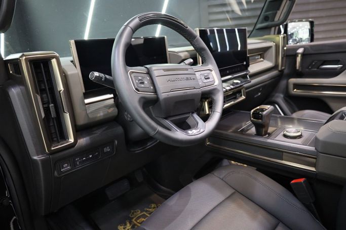 Used GMC Hummer EV, 2024 in Dubai by Sanam Cars, Black color. GCC Specs | AUTO.AE