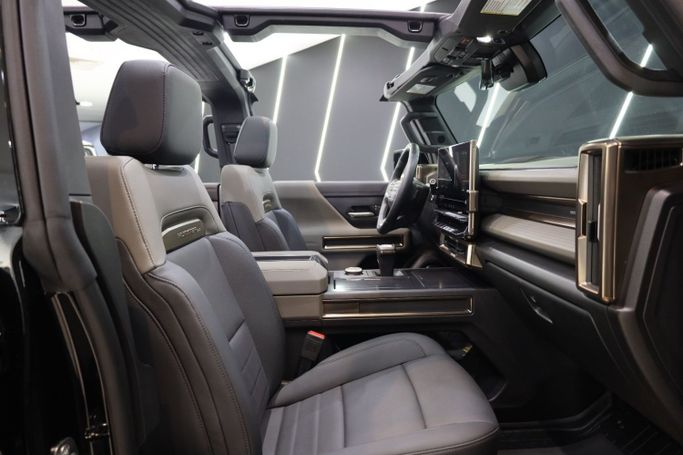 Used GMC Hummer EV, 2024 in Dubai by Sanam Cars, Black color. GCC Specs | AUTO.AE