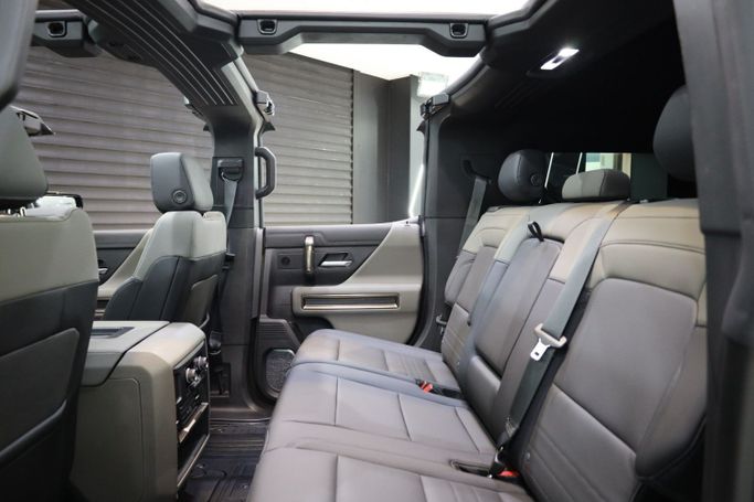 Used GMC Hummer EV, 2024 in Dubai by Sanam Cars, Black color. GCC Specs | AUTO.AE