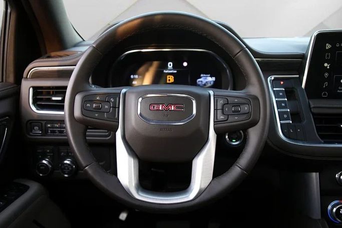 Used GMC Yukon V, 5.3 l, 2023 in Dubai by Mohammad Alkarak Motors, Black color. GCC Specs | AUTO.AE