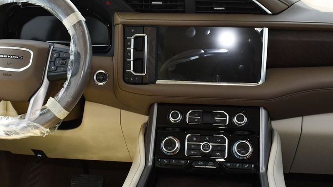 New GMC Yukon V, 6.2 l, 2023 in Dubai by Najem Motors, Black color. GCC Specs | AUTO.AE