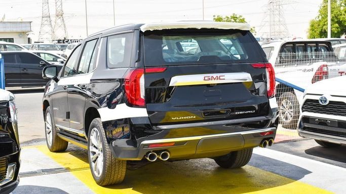 New GMC Yukon V, 6.2 l, 2023 in Dubai by Najem Motors, Black color. GCC Specs | AUTO.AE