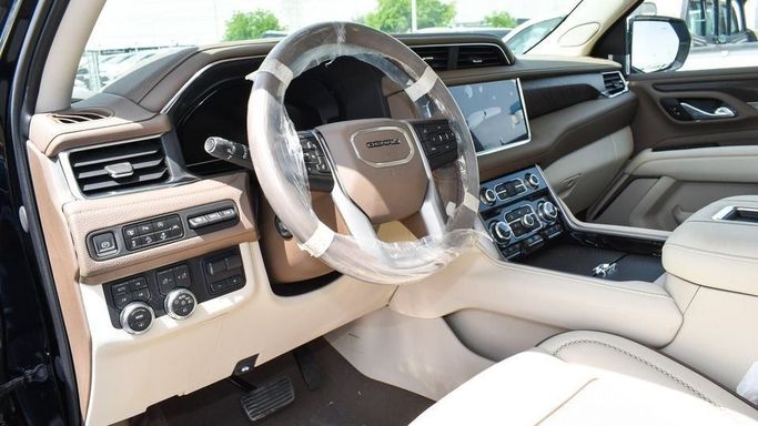 New GMC Yukon V, 6.2 l, 2023 in Dubai by Najem Motors, Black color. GCC Specs | AUTO.AE