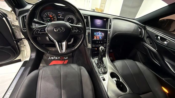 Used Infiniti Q60 II, 3.0 l, 2022 in Dubai by F1 Motors, White color. GCC Specs | AUTO.AE
