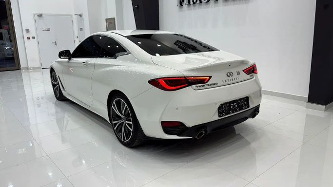 Used Infiniti Q60 II, 3.0 l, 2022 in Dubai by F1 Motors, White color. GCC Specs | AUTO.AE